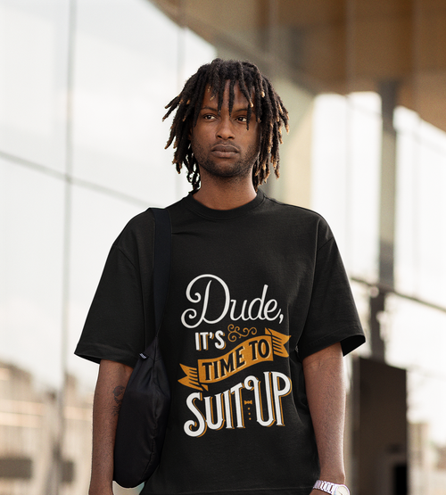 Man wearing a black t-shirt with text, standing outdoors.